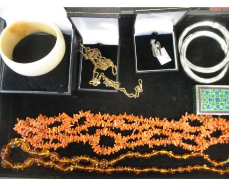 A small collection of jewellery, to include a coral necklace, an ivory bangle circa 1930, a pair of interlocking bangles, an 