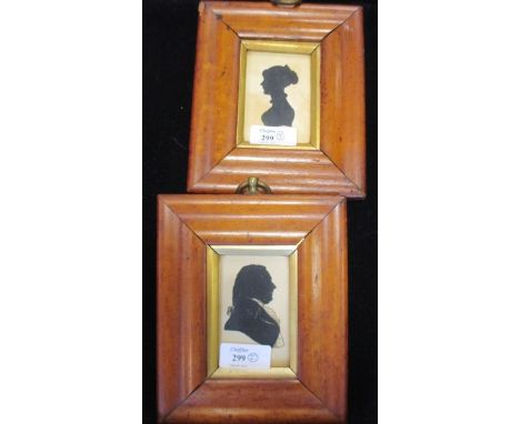 A pair of framed portrait silhouettes of a lady and gentleman, 16 x 3cm  