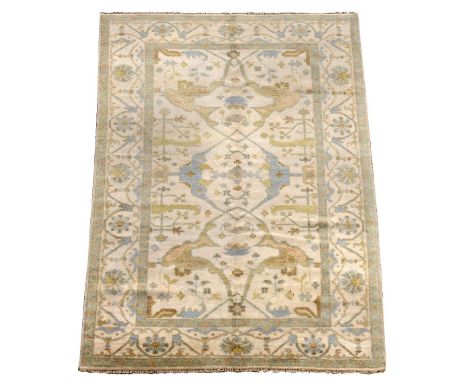 A Persian ivory ground rug, decorated in the Ming style 270 x 183cm (105 x 71in)  Good levels of pile