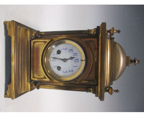 A Benson of London mantle clock, lacquered cast case with white dial and bell with striking French drum movement . c. 32cm hi