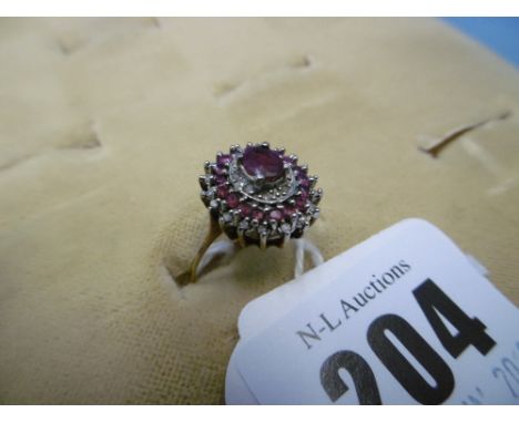 A 9ct yellow gold ruby and diamond cluster ring size O