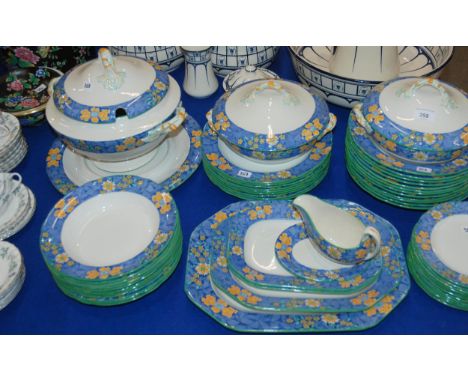 A Copeland Spode dinner service, the blue, white and yellow border decorated with flowers comprising plates, bowls, dishes, t