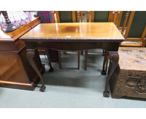 A Victorian mahogany foldover card table on shaped claw and ball supports Condition Report:Available upon request