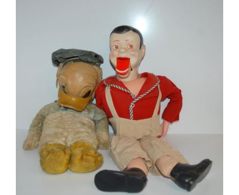 An early Chad Valley Donald Duck soft toy with rubber face, faded blue, white and yellow 40cm high (af) and an Archie Andrews