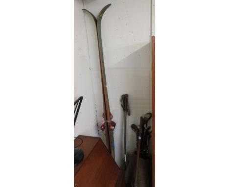 A mixed lot of golf clubs, skis, ski poles and a lacrosse stick Condition Report:Available upon request