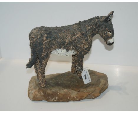 A studio pottery model of a donkey, mounted on stone base Condition Report:Available upon request