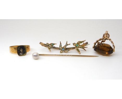 A 15ct gold ring, (af), weight 2.4gms a 9ct three swallows brooch, a 9ct citrine fob seal with a length of chain, and a yello