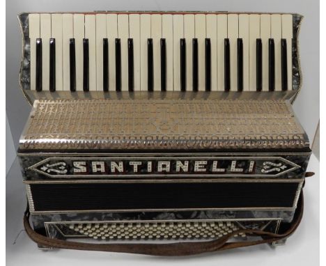 A 41 key 120 bass button Santianelli accordion, in faux mother of pearl with pierced nickel guard, together with original cas