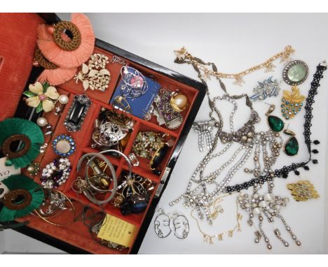 An oriental box, filled with vintage costume to include a Daniel Swarovski statement necklace Condition Report:Not available 