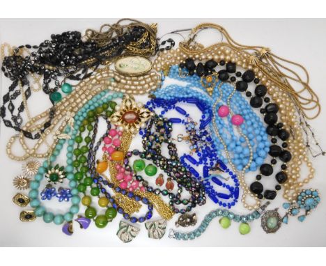 A string of green early plastic beads, Murano style beads, peacock crystals and other items of vintage Condition Report:Not a