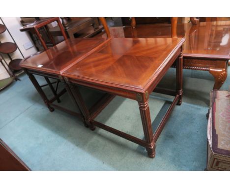 A pair of 20th century mahogany lamp tables on stretched supports (2) Condition Report:Available upon request
