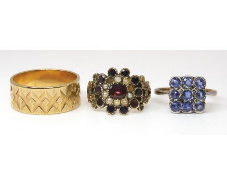 A yellow metal Victorian garnet and pearl ring (two pearls missing) size K1/2, a 9ct wedding ring, size P and a 9ct blue gem 