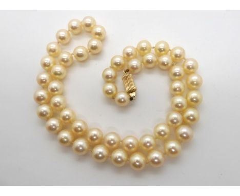 A string of cultured pearls with a 14k gold clasp, each pearl approx 7.7mm, length 45cm, weight 33.3gms Condition Report:Good