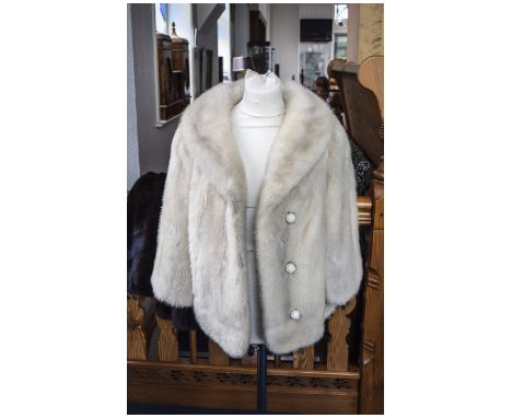 Ash Blonde Mink Opera Jacket, three quarter sleeves, slit pockets on the princess seam line, fastened with three crystal stud