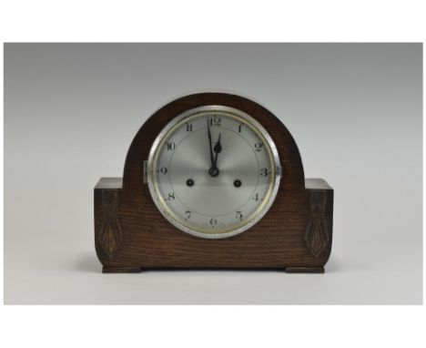 Early 20thC Oak Cased Mantle Clock, silvered dial, Arabic numerals. Marked Enfield. Ticking but not tested for accuracy.