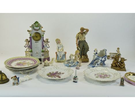 A Collection of German/Continental Ceramics comprising figural mantle clock, cherubs, fairings etc Together with a collection