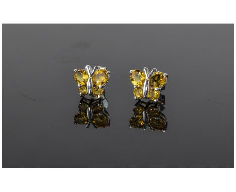 Citrine Butterfly Stud  Earrings, two oval and two round cut citrines representing the wings of the butterflies, to each earr