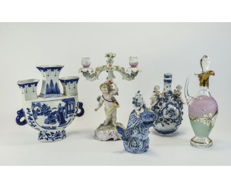 Mixed Lot of Pottery comprising German blue and white cherub vase, pierced work and applied rose vine, Figural cherub candela