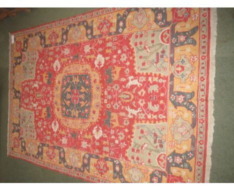 Wool carpet with all over design of animals, birds in branches with patterned borders 273cm x 182cm 