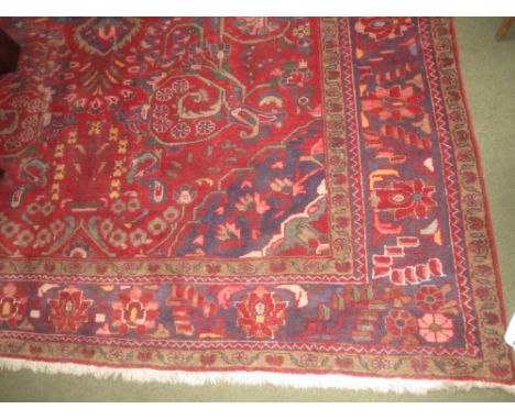 Iranian carpet, red ground all over geometric pattern with border 375cmx251cm