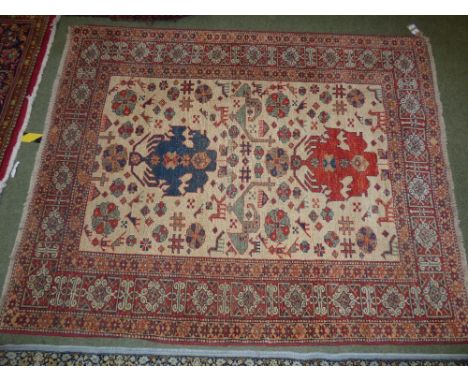 Small Persian carpet, cream ground with stylised animals &  bird motifs within a geometric border, 