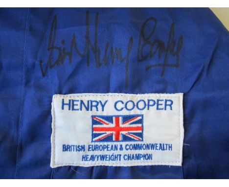 HENRY COOPER SIGNED ROBE    Signed replica dark blue dressing robe with white trimmings and an embroidered patch showing  "He