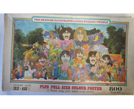 THE BEATLES    800 Piece jigsaw entitled "The Beatles Illustrated Lyrics Puzzle", Poster and Answer sheet in original box (ce