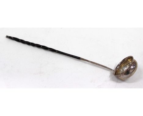 AN ANTIQUE WHITE METAL TODDY LADLE with twisted whalebone handle and set with a coin dated 1733 and with motto 'Quocunque ied