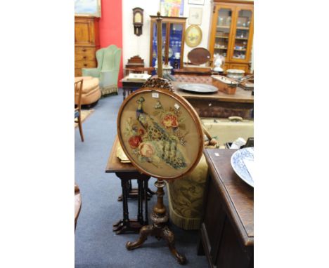 A VICTORIAN MAHOGANY BEADED TAPESTRY FIRE SCREEN with a turned support and tripod base, 53cm wide together with a Hinks & Son