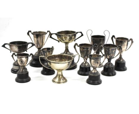 EIGHT EARLY 20TH CENTURY SMALL SILVER TROPHY CUPS from the Carlton Ladies Tennis Club and awarded to K.Smellie and three silv