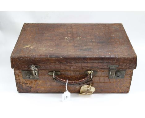 A VINTAGE CROCODILE SKIN TRAVELLING CASE with fitted leather compartments inside, lined with crocodile skin, 46m x 30cm x 18c