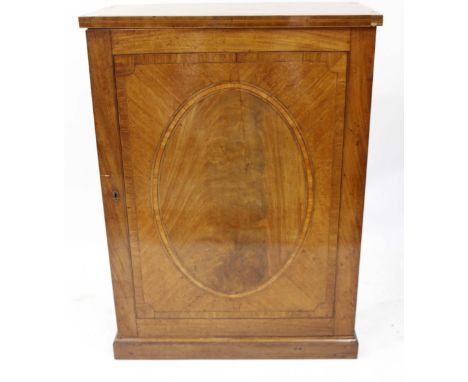 A GEORGIAN AND LATER MAHOGANY CUPBOARD with cross banded top, the door with oval inlaid panel, 86.5cm wide x 117cm high