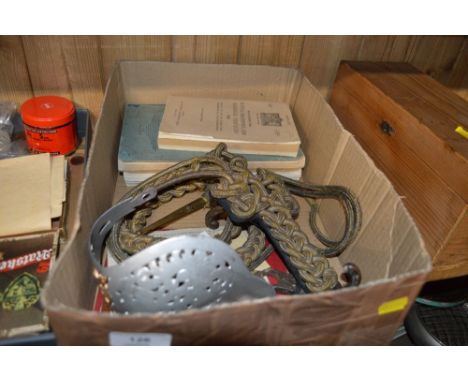 A box containing various WW2 military training booklets, soldiers service documents, an Edward VII sword guard; and a Victori