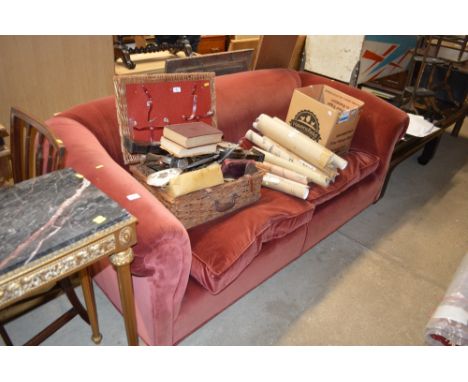 A red velvet upholstered sofa