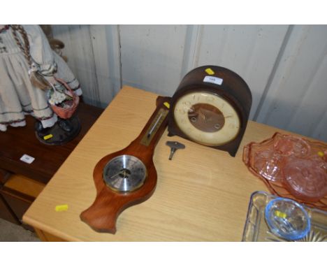 A Smiths oak cased two hole mantel clock and a barometer