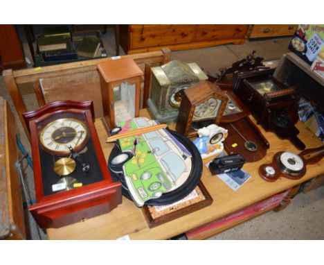 A quantity of various wall and mantel clocks and a Canon camera