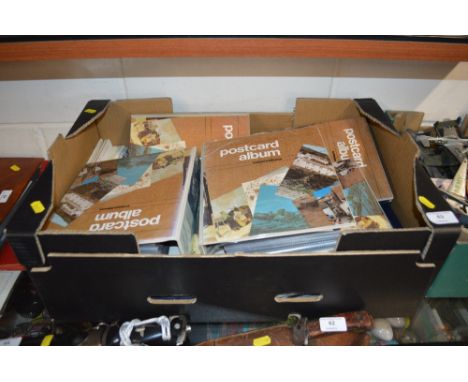 A box containing albums f post-cards 