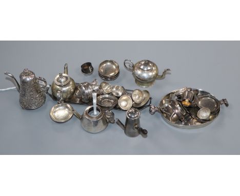 A collection of English and Dutch miniature silver and white metal tableware, including a chocolate pot with jug, sugar bowl,