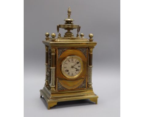 A 19th century gilt brass and silvered metal mantel clock, J W Benson, London, having white Roman dial and ornate architectur