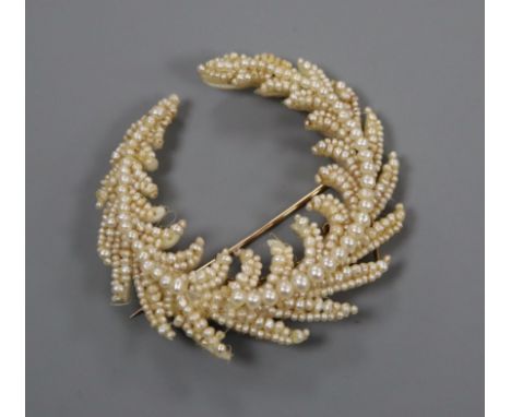 A Regency seed pearl set mother of pearl spray brooch, (repair), 55mm.
