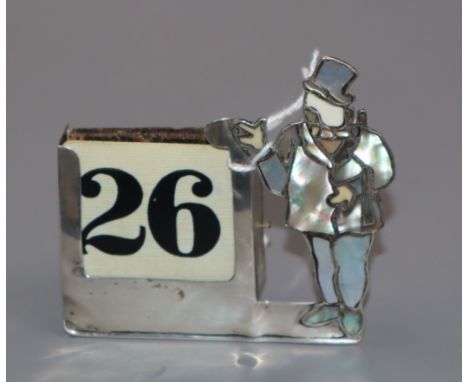 A George V silver, mother of pearl and ivory desk calendar, London, 1931, 7.2cm.