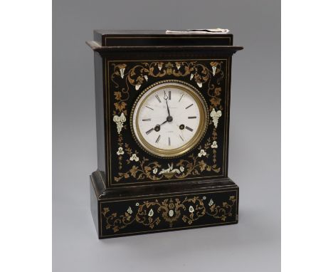 A 19th century French brass inlaid ebonised mantel clock