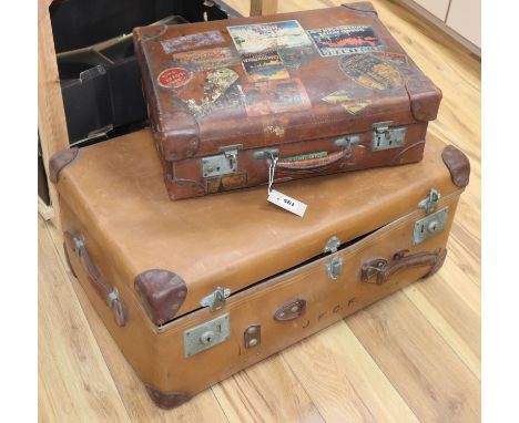A red leather lined suitcase with 1930's labels, a trunk and laundry box