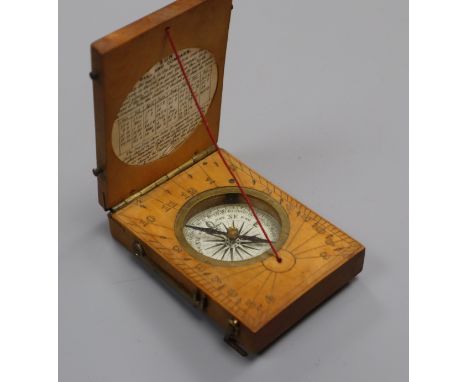 A boxwood sundial and compass
