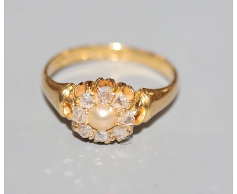 A late Victorian 18ct gold, rose cut diamond and split pearl set cluster ring, size O.
