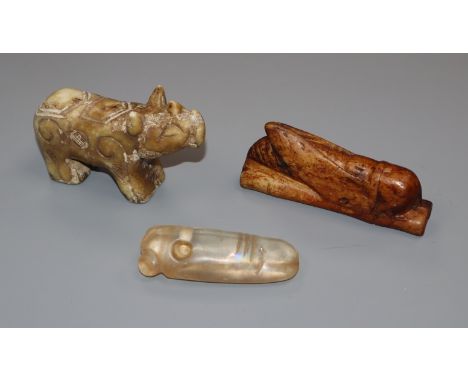 An archaistic jade carving of a cicada, a rock crystal cicada and a rhino figure tallest 5cm