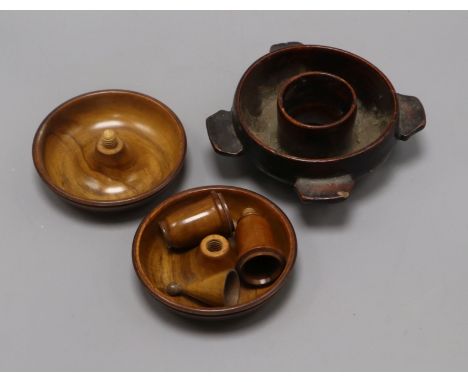 A treen flea trap and and an olivewood candlestick