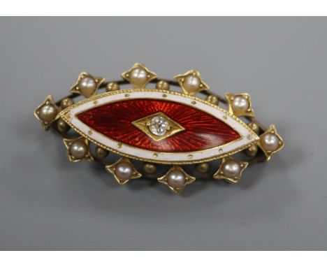A late Victorian, yellow metal, enamel, diamond and seed pearl set elliptical brooch, 33mm.