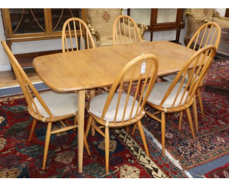 An Ercol dining table and chairs, and a sideboard 150cm, 155cm