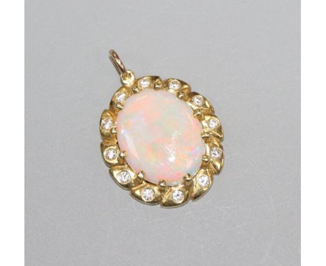 A modern yellow metal, white opal and diamond cluster set oval pendant, 2cm.